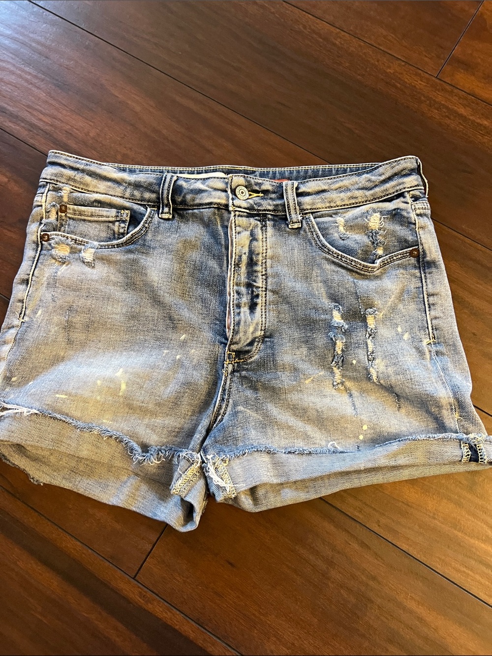 Anthropologie denim shorts size 30, nicely distressed, frayed and paint spatters